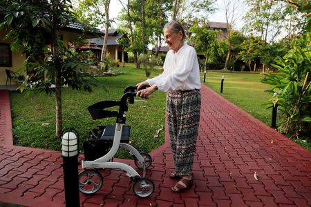 Marian a retiree from San Francisco, California walks in a garden while staying at the Care Resort in Chiang Mai, Thailand April 5, 2018. Picture taken April 5, 2018. REUTERS/Jorge Silva