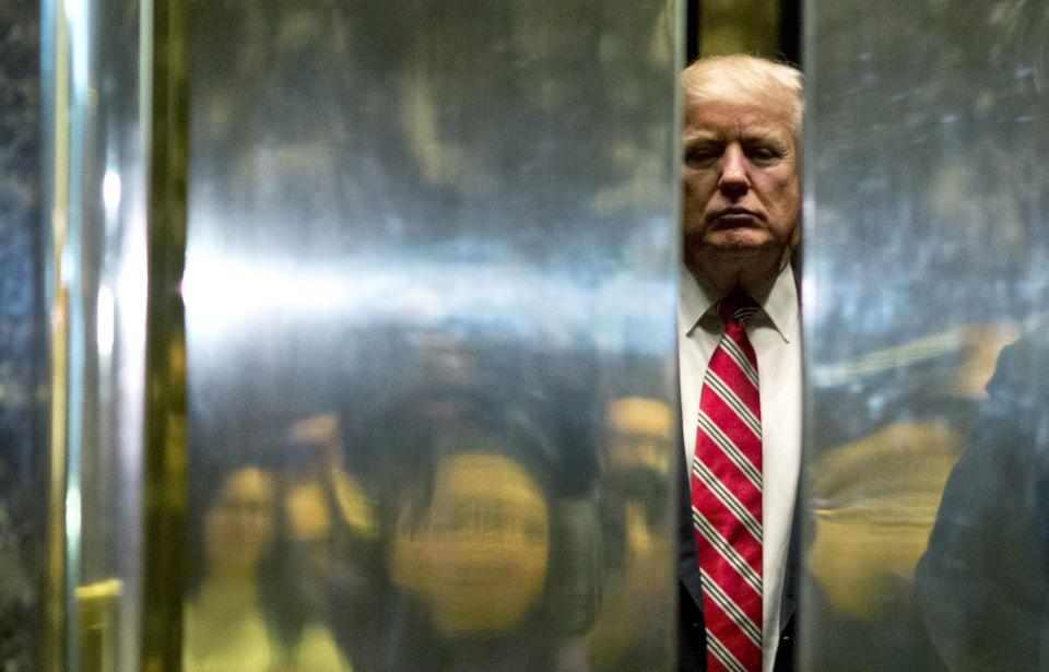 Then-President-elect Donald Trump boards an elevator in Trump Tower in New York City on Jan. 16, 2017.