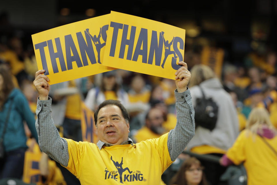 A fan holds signs thanking Seattle Mariners starting pitcher Felix Hernandez before the Mariners' baseball game against the Oakland Athletics, Thursday, Sept. 26, 2019, in Seattle. The game is Hernandez's final start of the season. (AP Photo/Ted S. Warren)