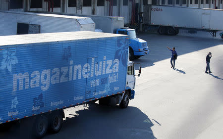 Trucks of retail Magazine Luiza S.A. is seen parked at their logistical center in Louveira, Brazil April 24, 2018. REUTERS/Paulo Whitaker