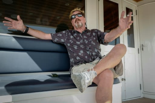 US millionaire John McAfee gestures during an interview with AFP on his yacht anchored at Havana's Marina Hemingway on June 26, 2019, while, he says, planning a US presidential run