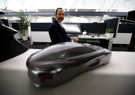 Infiniti, Nissan Motor's premium brand, Executive Design Director Karim Habib poses for a photo behind the brand's car model at its Global Design Center in Atsugi, Japan, April 18, 2018. Picture taken April 18, 2018. REUTERS/Toru Hanai