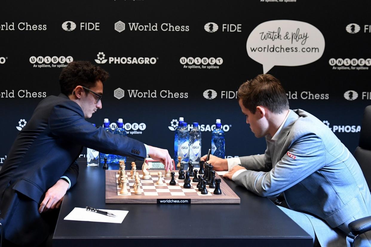 Norway's World Chess Champion Magnus Carlsen (R) and his US challenger Fabiano Caruana: EPA