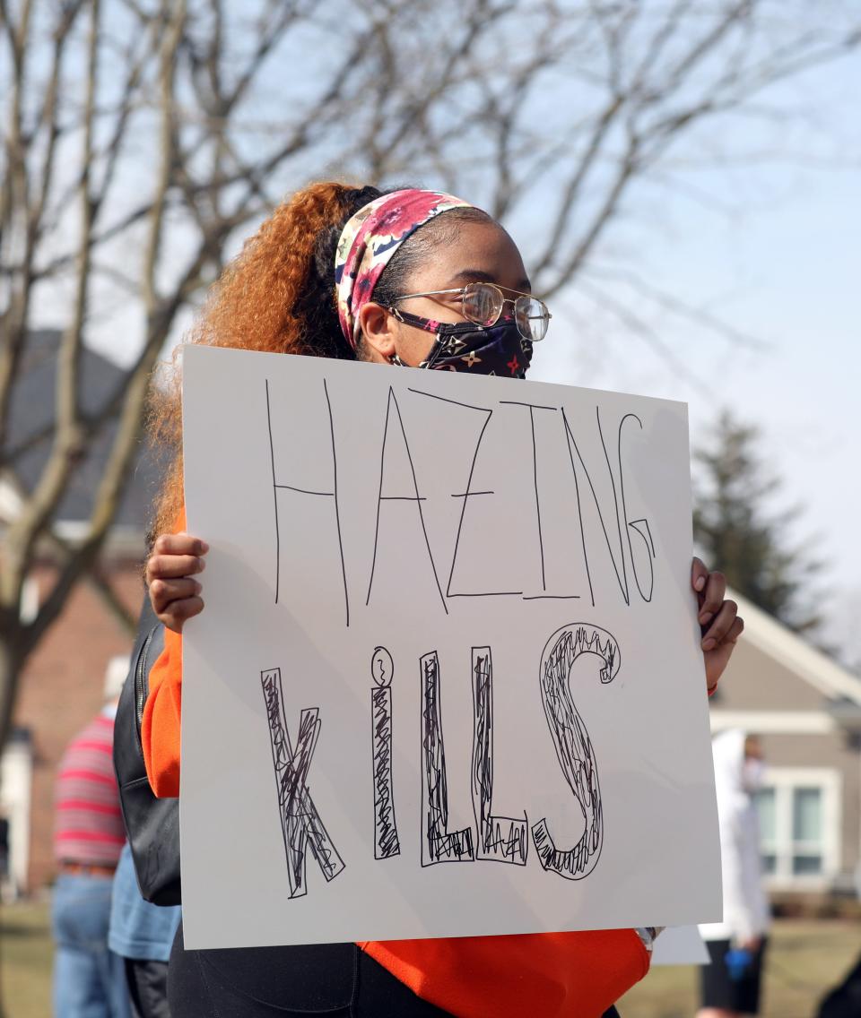 BGSU student Aarian Lynn protests at Bowling Green State University in March 2021 after Stone Foltz died from a hazing incident. BGSU President Rodney Rogers said the university has positioned itself to be a leader in the anti-hazing movement in Ohio.