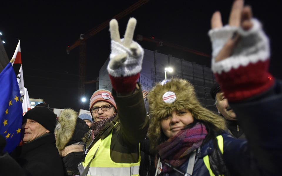 Anti-government protesters march through central Warsaw on the anniversary of imposition of the 1981 martial law by the country's former communist regime, in Warsaw, Poland, Tuesday, Dec. 13, 2016. (AP Photo/Alik Keplicz)