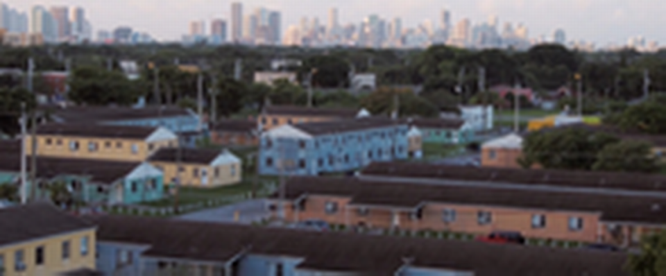 An overhead shot of the old Liberty Square with the Miami skyline in the background in the documentary “Razing Liberty Square.” Set to release Jan. 29 on PBS, “Razing Liberty Square” explores how climate gentrification led to the redevelopment of the Liberty Square public housing project.