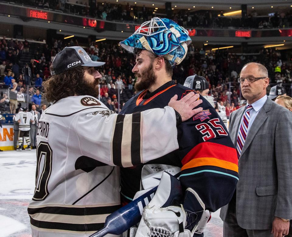 Coachella Valley goaltender Joey Daccord (35) shares a few words with Hershey goaltender Hunter Shepard (30) in the handshake line after Game 7 of the Calder Cup Finals at Acrisure Arena in Palm Desert, Calif., Wednesday, June 21, 2023. 