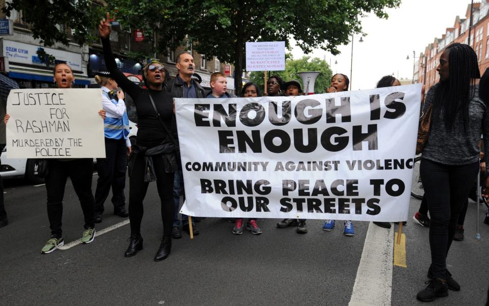 Members from Hackey Stand Up To Racism protest outside Stoke Newington Police Station, - Credit: Lauren Hurley/PA