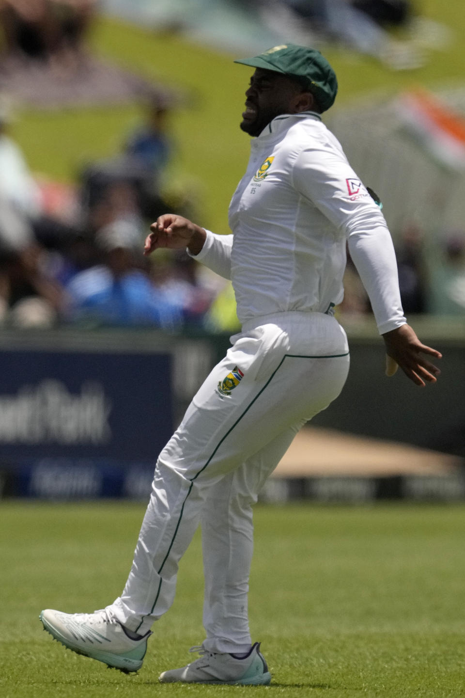 South Africa's captain Temba Bavuma in pain as he chases the ball during the first day of the Test cricket match between South Africa and India, at Centurion Park, South Africa, Tuesday, Dec. 26, 2023. (AP Photo/Themba Hadebe)