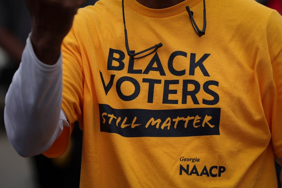 In Georgia, lawsuits seek to determine whether the legislature intentionally diluted Black voting power. Above, an audience member wears a “Black Voters Still Matter” T-shirt from the Georgia NAACP during a Get Out the Vote rally in December 2022 in Hephzibah, Georgia. (Photo by Win McNamee/Getty Images)