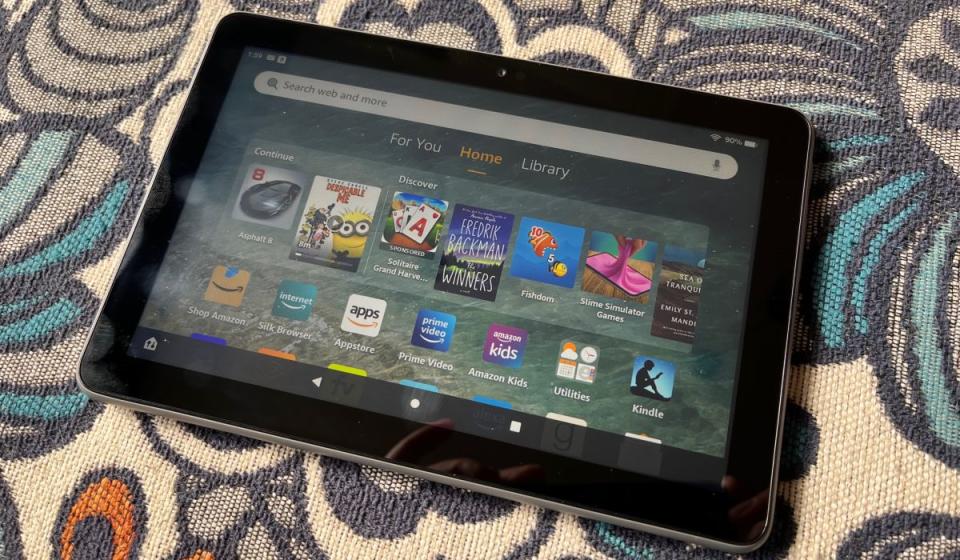 The Fire HD 8 Plus home screen displaying various apps and media.