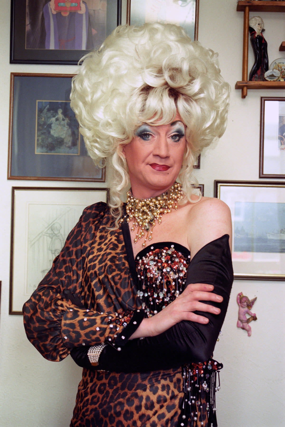 Alter ego: O’Grady in character as Lily Savage, complete with trademark blonde wig (PA)