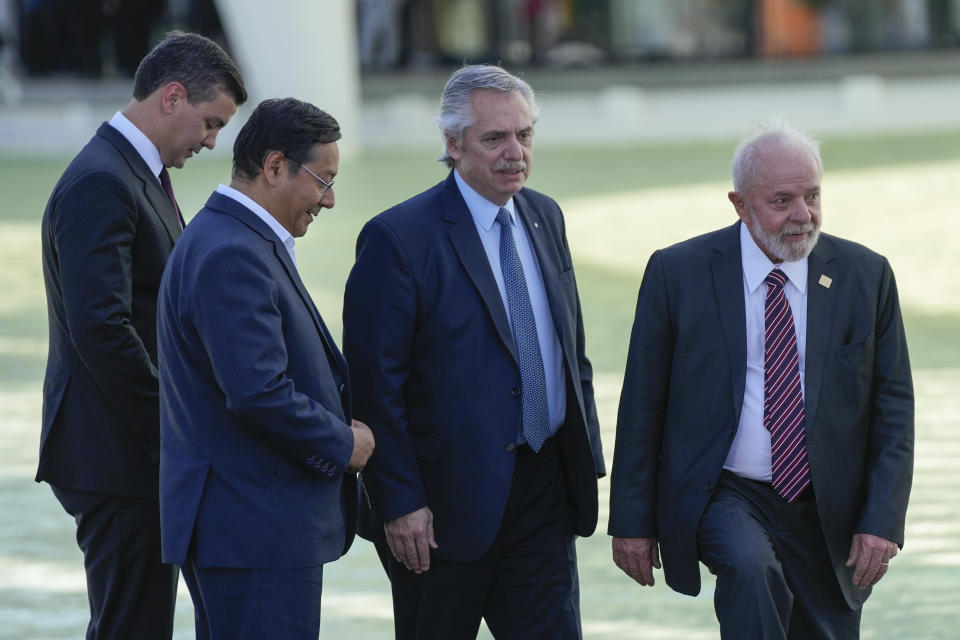 Brazilian President Luiz Inacio Lula da Silva, right, Argentina's outgoing President Alberto Fernandez, second from right, Bolivia's President Luis Arce, and Paraguay's President Santiago Pena, left, arrive for a group photo at the 63rd Mercosur Summit, in Rio de Janeiro, Brazil, Thursday, Dec. 7, 2023. (AP Photo/Silvia Izquierdo)