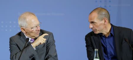 FILE PHOTO: Greek Finance Minister Yanis Varoufakis and German Finance Minister Wolfgang Schaeuble (L) address a news conference following talks at the finance ministry in Berlin February 5, 2015. REUTERS/Fabrizio Bensch/File Photo