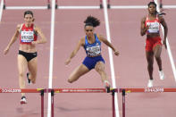 File-This Oct. 2, 2019, file photo shows Sydney McLaughlin of the United States, center, Lea Sprunger of Switzerland, left, and Aminat Jamal of Bahrain, right, competing in the women's 400 meter hurdles semifinal at the World Athletics Championships in Doha, Qatar. The 20-year-old from New Jersey finished second to Dalilah Muhammad at the world championships. Muhammad set a new world record in Qatar (52.16 seconds), with McLaughlin right on her heels. That record may keeping going lower and lower. (AP Photo/Martin Meissner, File)