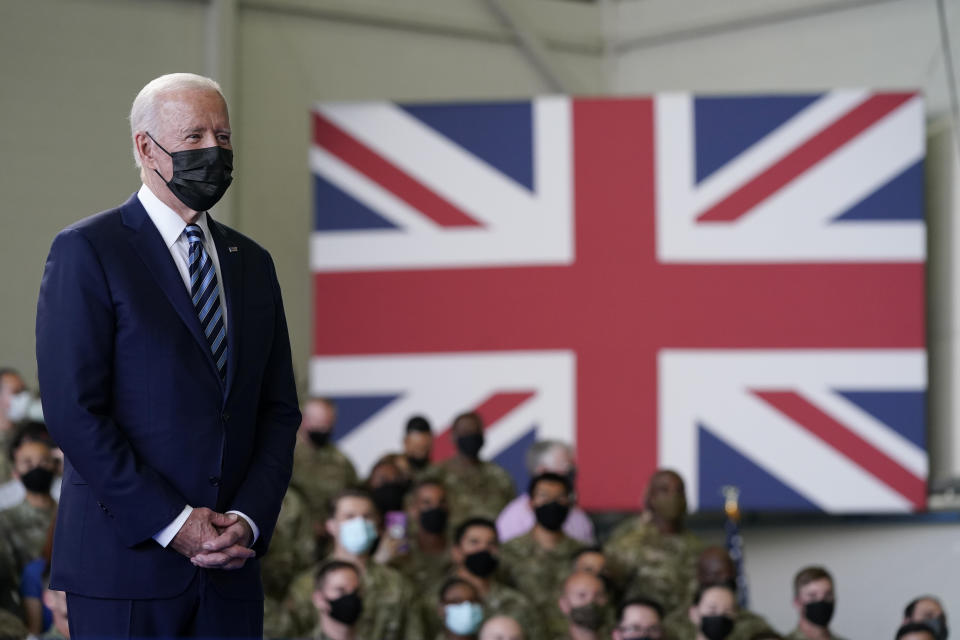 FILE - In this June 9, 2021, file photo, President Joe Biden listens as first lady Jill Biden speaks to American service members at RAF Mildenhall in Suffolk, England. Helping countries recover from the coronavirus pandemic will be at the top of the agenda for the Group of Seven summit when British Prime Minister Boris Johnson welcomes Biden and the leaders of France, Germany, Italy, Japan and Canada to the cliff-ringed Carbis Bay beach resort in southwestern England on Friday, June 11. (AP Photo/Patrick Semansky, File)