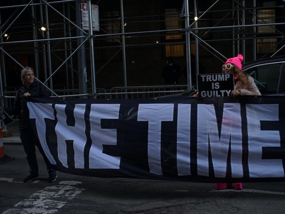 Demonstrators outside Manhattan Criminal Court following the news that a Grand Jury voted to indict former Pres. Donald Trump