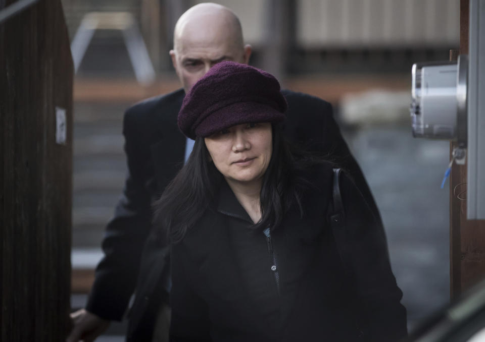 Huawei chief financial officer Meng Wanzhou, who is out on bail and remains under partial house arrest after she was detained Dec. 1 at the behest of American authorities, leaves her home to attend a court appearance regarding her bail conditions, in Vancouver, British Columbia, Tuesday Jan. 29, 2019. (Darryl Dyck/The Canadian Press via AP)