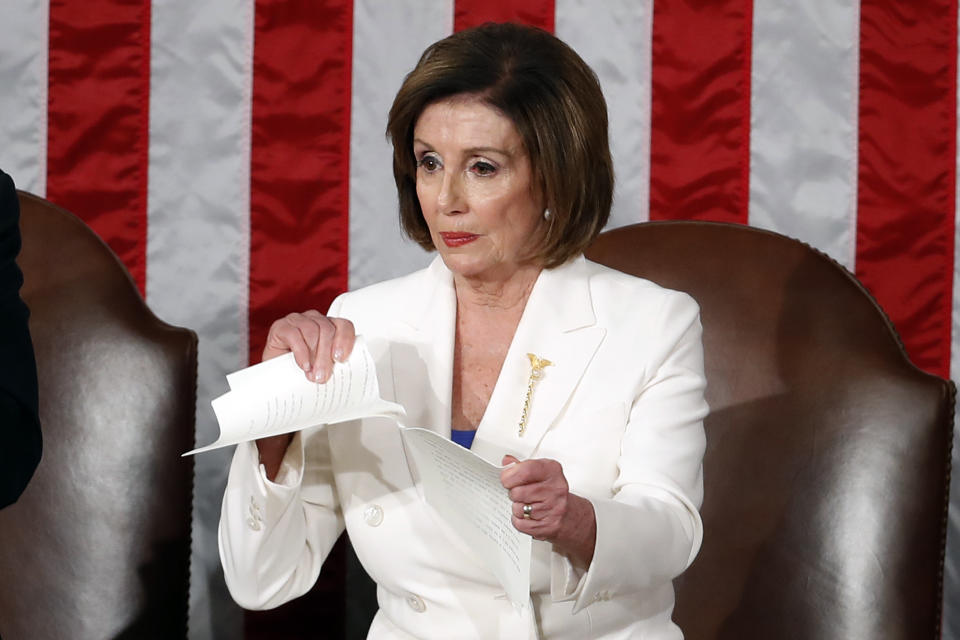 FILE - House Speaker Nancy Pelosi of Calif., tears her copy of President Donald Trump's State of the Union address after he delivered it to a joint session of Congress on Capitol Hill in Washington, Feb. 4, 2020. (AP Photo/Alex Brandon, File)