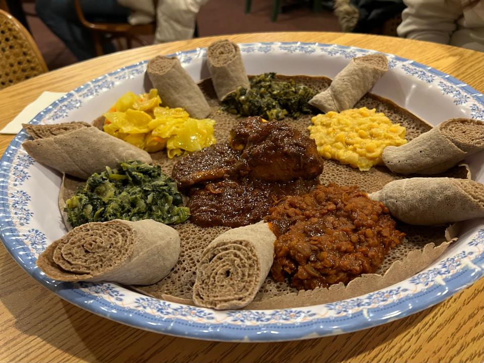 The vegan combo at Alem Ethiopian Village comes with four dishes from the restaurant's vegan menu. On my visit, I added a spicy chicken stew to the platter.