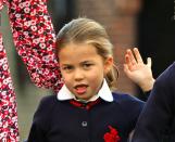 <p>Princess Charlotte makes a silly face as she waves to photographers.</p>