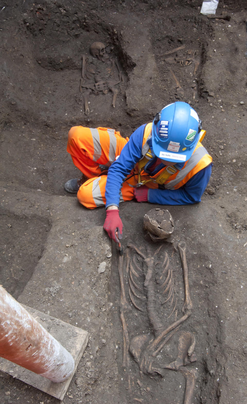 In this undated but recent photo supplied Friday March 15, 2015, by the London Crossrail Project, showing archaeologists working on the UK’s largest infrastructure project, Crossrail, as they uncover an historical burial ground in central London. Scientists were called in to investigate bones found during the digging of a new railway in central London, after uncovered 13 skeletons were found. The skeletons will be tested to see if they died from the Black Death plague which killed between 30 and 60 percent of the European population in the 14th century, and scientist hope to map the DNA signature of the plague bacteria. (AP Photo / Crossrail Project)