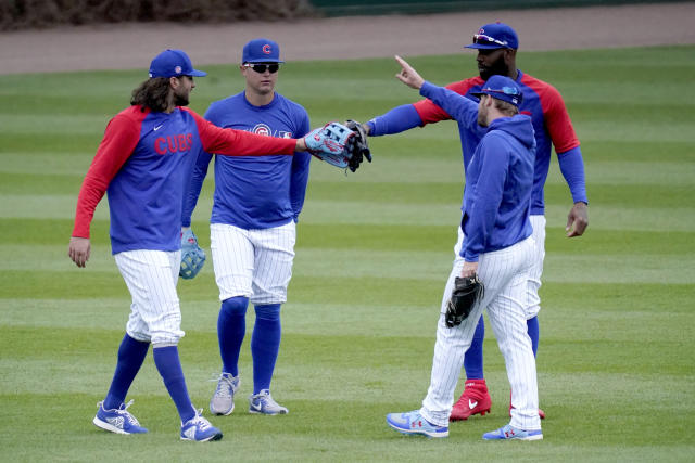 The Chicago Cubs outfielders, from left, Jake Marisnick, Joc Pederson, Jason Heyward, and Ian Happ, come together during the team's last baseball workout Wednesday, March 31, 2021, before opening day Thursday, April 1, 2021, against the Pittsburgh Pirates in Chicago. (AP Photo/Charles Rex Arbogast)