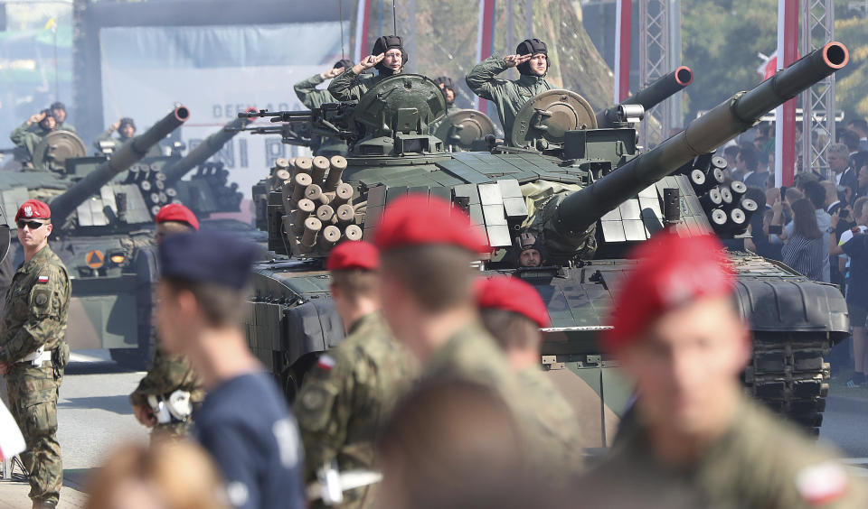 Polish military parade during the annual Armed Forces review during a national holiday, in Katowice, Poland, Thursday, Aug. 15, 2019. Large crowds turned out for the celebration which this year included a fly-over by two U.S. F-15 fighter jets.(AP Photo/Czarek Sokolowski)