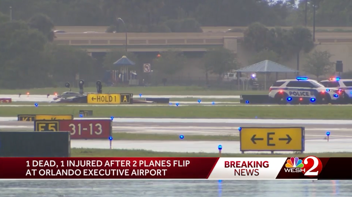 Police and fire services at Orlando Executive Airport after a plane flipped at around 5pm on Thursday, 1 September 2022 (Screengrab/Wesh)