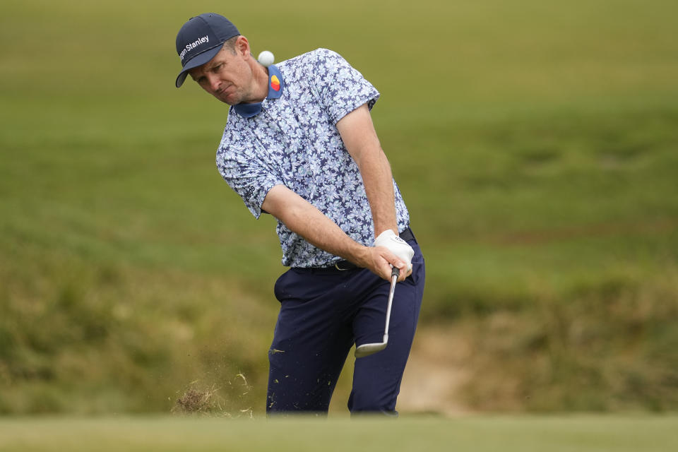 Justin Rose chips to the green on the second hole during the first round of the U.S. Open golf tournament at Los Angeles Country Club on Thursday, June 15, 2023, in Los Angeles. (AP Photo/George Walker IV)