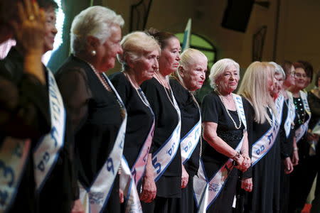 Holocaust survivors stand on a stage during a beauty contest for survivors of the Nazi genocide in the northern Israeli city of Haifa, November 24, 2015. REUTERS/Amir Cohen