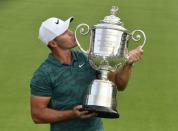 Aug 12, 2018; Saint Louis, MO, USA; Brooks Koepka poses with the Wanamaker Trophy after winning the PGA Championship golf tournament at Bellerive Country Club. Mandatory Credit: Jeff Curry-USA TODAY Sports