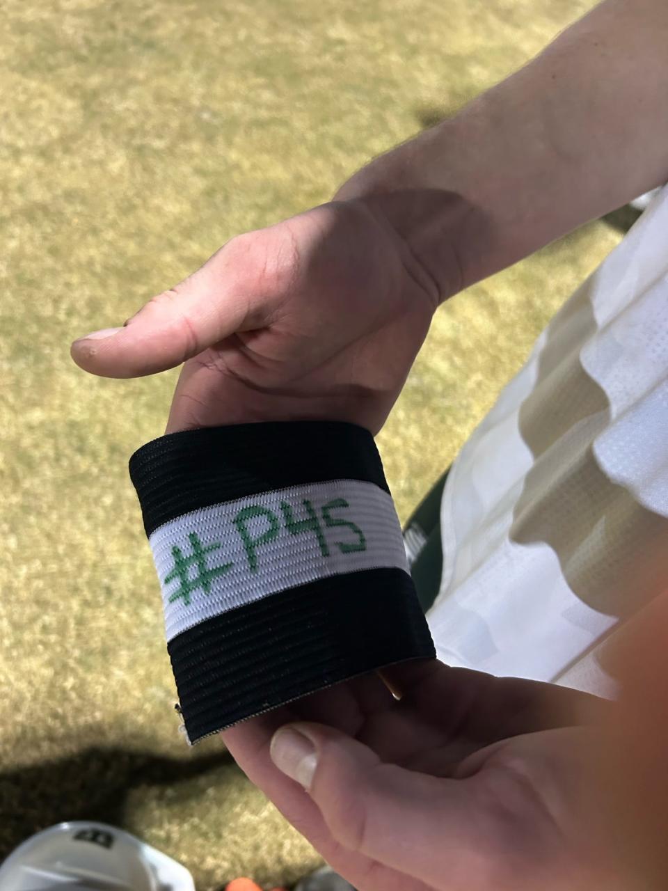 The inside of Tommy Hanna's captain's armband bears the hashtag #P4S -- Play 4 Sam -- in honor of brother who died.