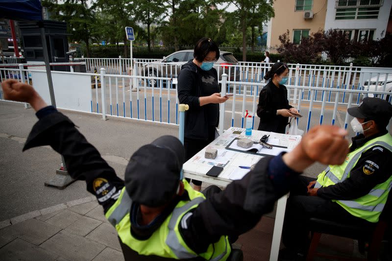 Woman enters details into her health app after scanning a QR code in Beijing