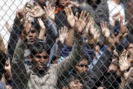 Migrants who will be returned to Turkey demonstrate inside the Moria registration centre on the Greek island of Lesbos, April 5, 2016. REUTERS/Giorgos Moutafis/File Photo