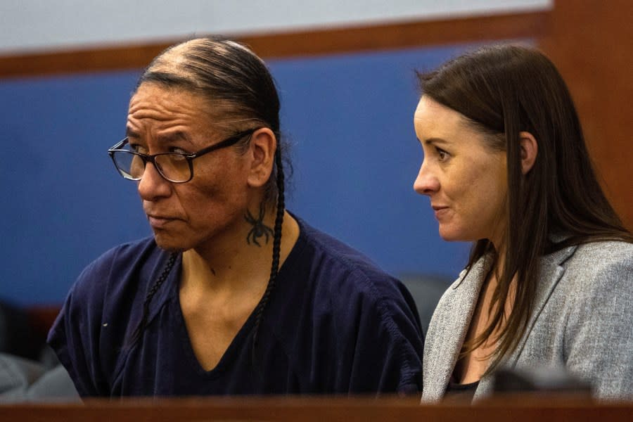 FILE - Nathan Chasing Horse, left, and Clark County public defender Kristy Holston listen during a court hearing on April 5, 2023, in Las Vegas. The sexual abuse trial of a former “Dances With Wolves” actor charged in Nevada with abusing Indigenous women and girls for more than a decade is on hold indefinitely, according to Clark County District Judge Carli Kierny on Wednesday, April 12, 2023. (AP Photo/Ty O'Neil, File)