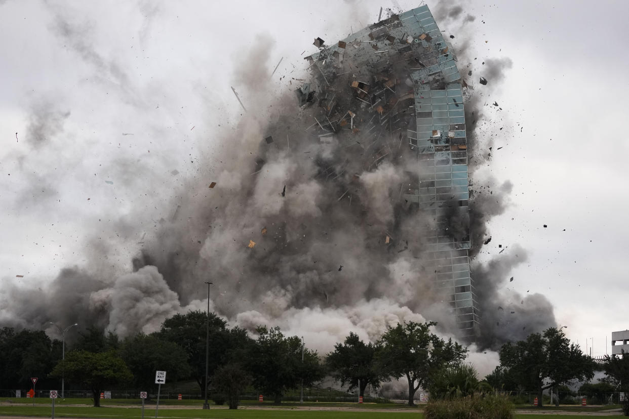 The Hertz Tower, which was heavily damaged after Hurricanes Laura and Delta in 2020, is imploded in Lake Charles, La., Saturday, Sept. 7, 2024. (AP Photo/Gerald Herbert)