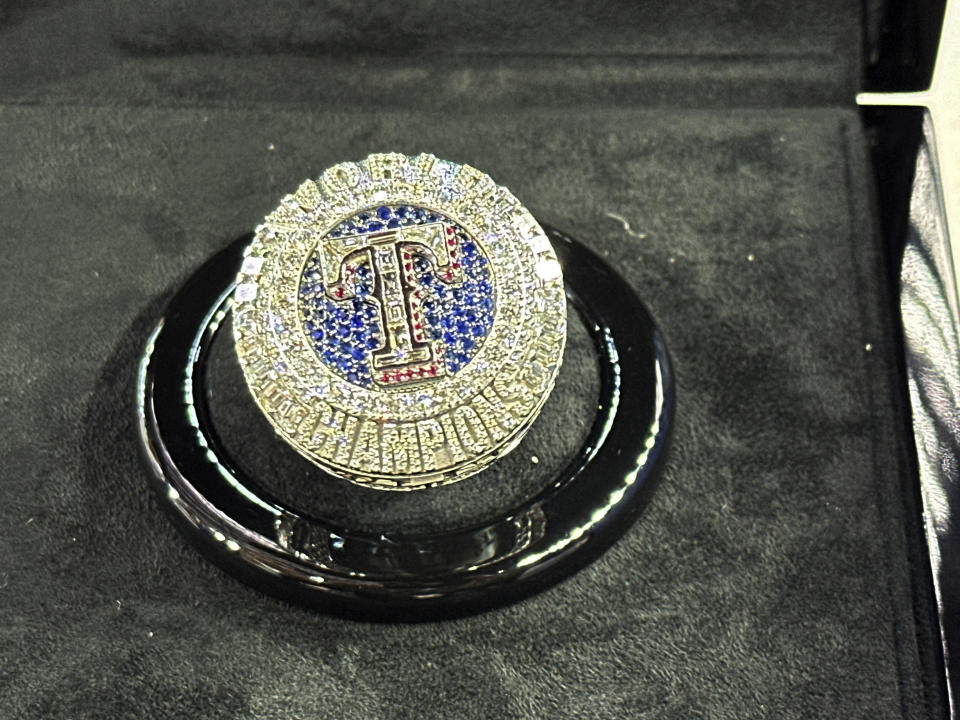 The Texas Rangers championship ring is seen Saturday, March 30, 2024 in Arlington Texas. The Texas Rangers and staff will receive their World Series championship rings during a pre-game ceremony before the Texas Rangers take on the Chicago Cubs in a baseball game. (AP Photo/Stephen Hawkins)