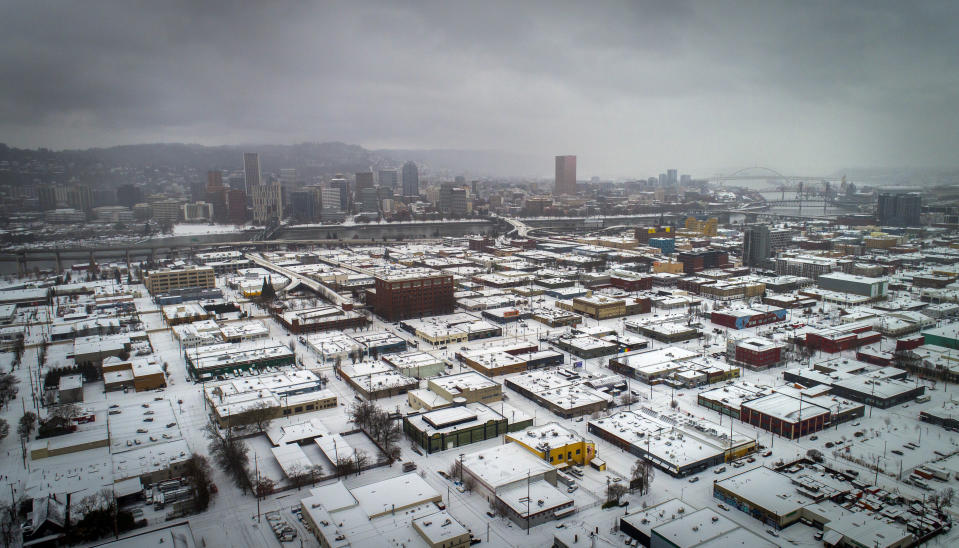 An aerial view of Southeast Portland, Ore., is seen during a snowstorm, on Friday, February 12, 2021. (Brooke Herbert/The Oregonian via AP)