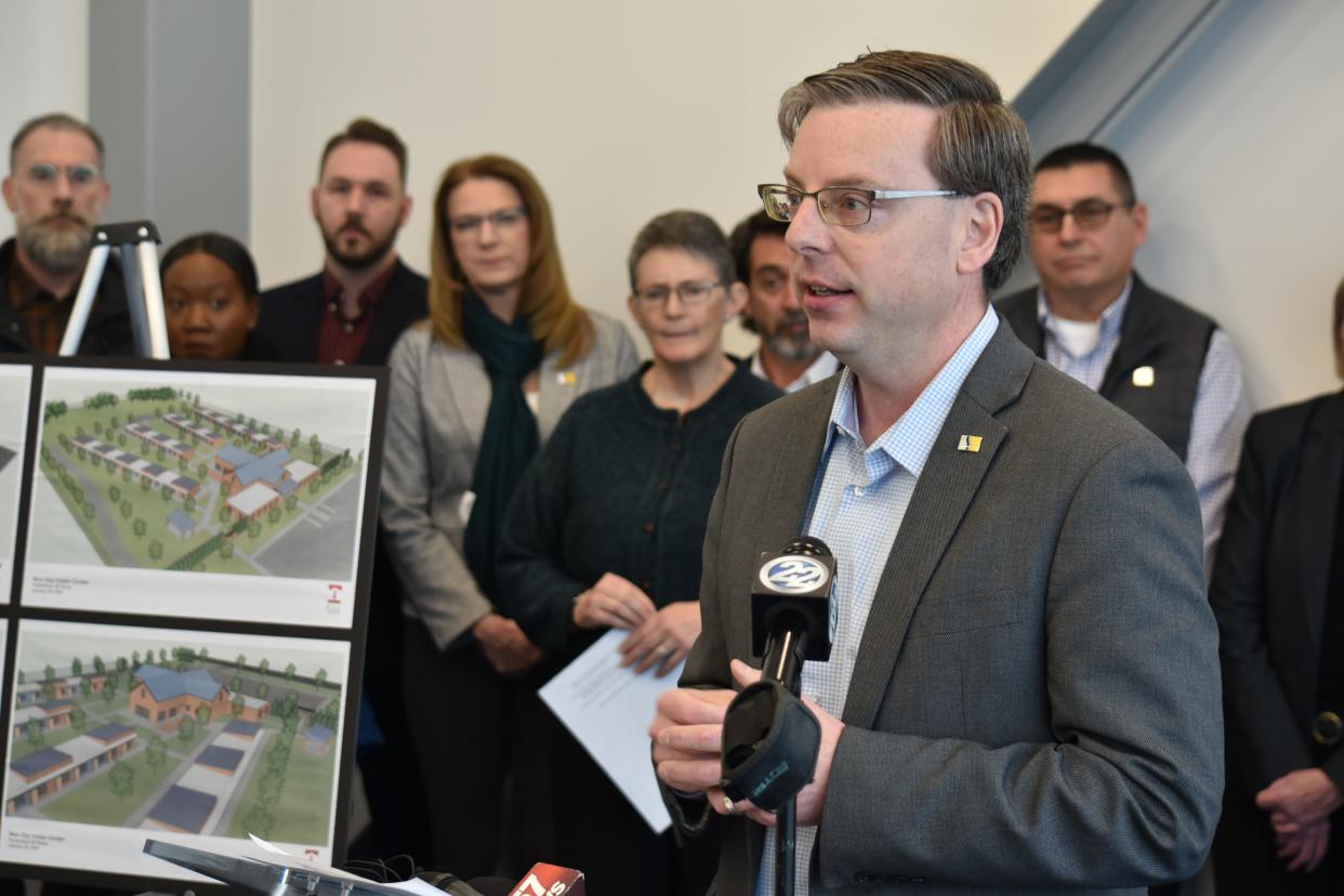 Flanked by top city officials and homeless advocates, South Bend Mayor James Mueller defends the proposed site of an 80-bed low-barrier homeless shelter at a press conference Friday, Jan. 26, 2024.