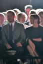 <p>Meghan looks at Prince Harry.</p>