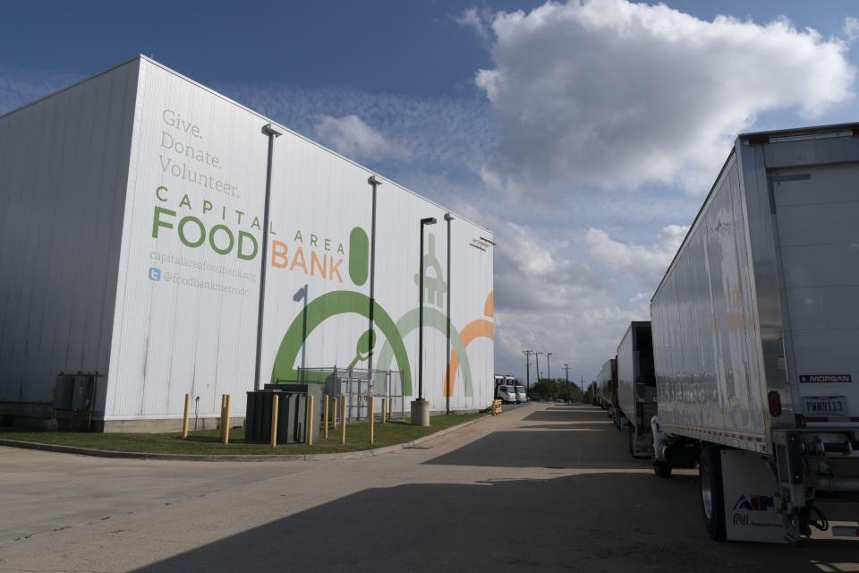 The warehouse for The Capital Area Food Bank is seen by a fleet of trucks, Tuesday, Oct. 5, 2021, in Washington. (AP Photo/Jacquelyn Martin)