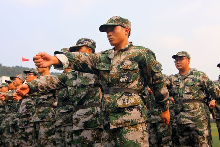 <span class="caption">University students take part in military training in Xiangyang, Hubei province, China.</span> <span class="attribution"><span class="source">Shutterstock</span></span>