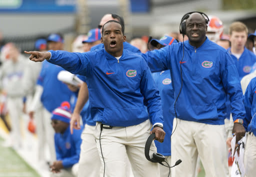 Florida head coach Randy Shannon argues a call with a referee during the first half of an NCAA college football game against Missouri Saturday, Nov. 4, 2017, in Columbia, Mo. Missouri won the game 45-16. (AP Photo/L.G. Patterson)