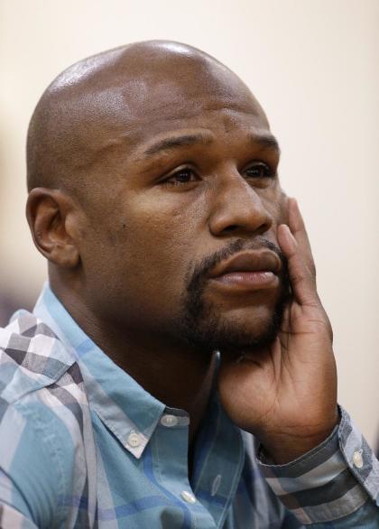 Floyd Mayweather told the Nevada Athletic Commission there were breaks during the 31-minute round. (AP)