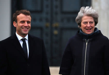 France's President Emmanuel Macron and Britain's Prime Minister Theresa May inspect troops at Sandhurst Military Academy, Britain, January 18, 2018. REUTERS/Hannah McKay