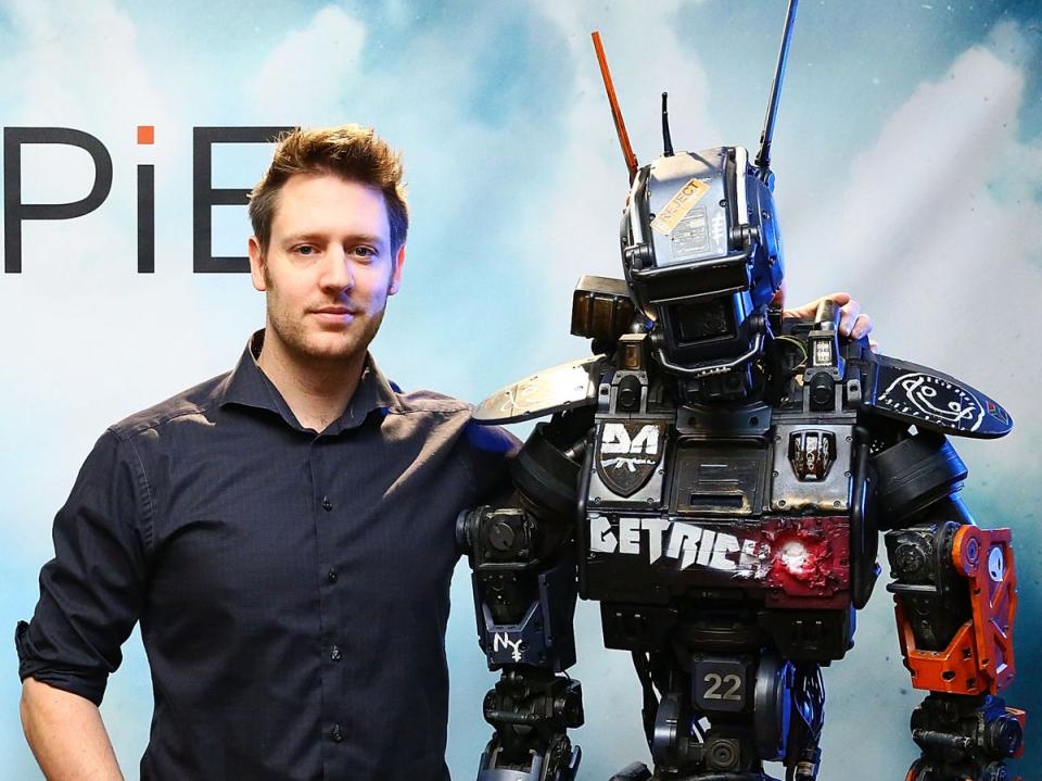 Blomkamp poses with the ‘Chappie' prop in 2015 (Getty Images)