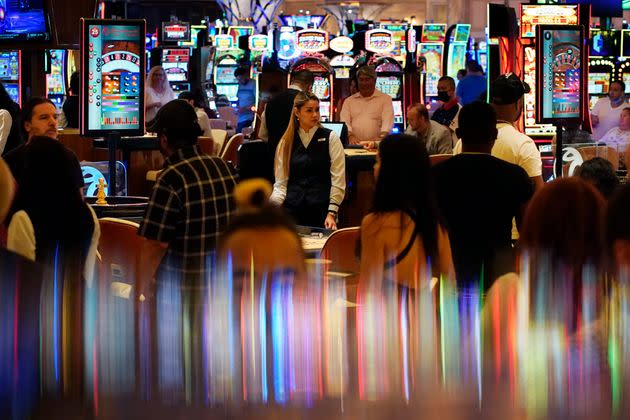 Crowds walk through the Resorts World Las Vegas casino during its opening night last month. Elected officials in tourism-dependent Las Vegas are worried about public health and the economic effects of a spike in COVID-19 cases, particularly involving the highly contagious delta variant. (Photo: via Associated Press)