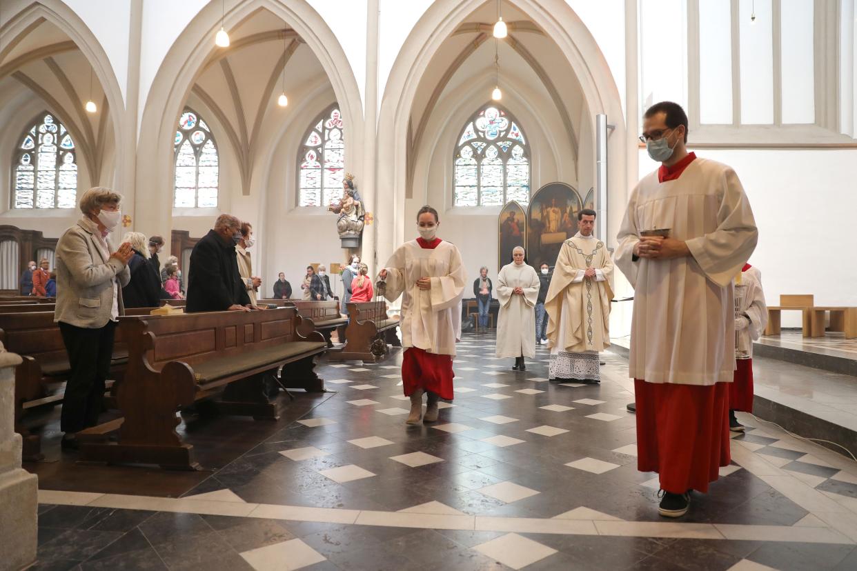 Dean Wolfgang Picken speaks to the audience as his church members wear a protective face mask during a Sunday mass at St. Remigius Catholic church for the first time since March during the novel coronavirus crisis on May 3, 2020, in Bonn, Germany. The state of North Rhine-Westphalia is the first in Germany to allow churches and other houses of worship to hold services again since May 1, and other states are to follow beginning May 4. Nationwide state and local governments are easing lockdown measures imposed in March in order to stem the spread of the virus.