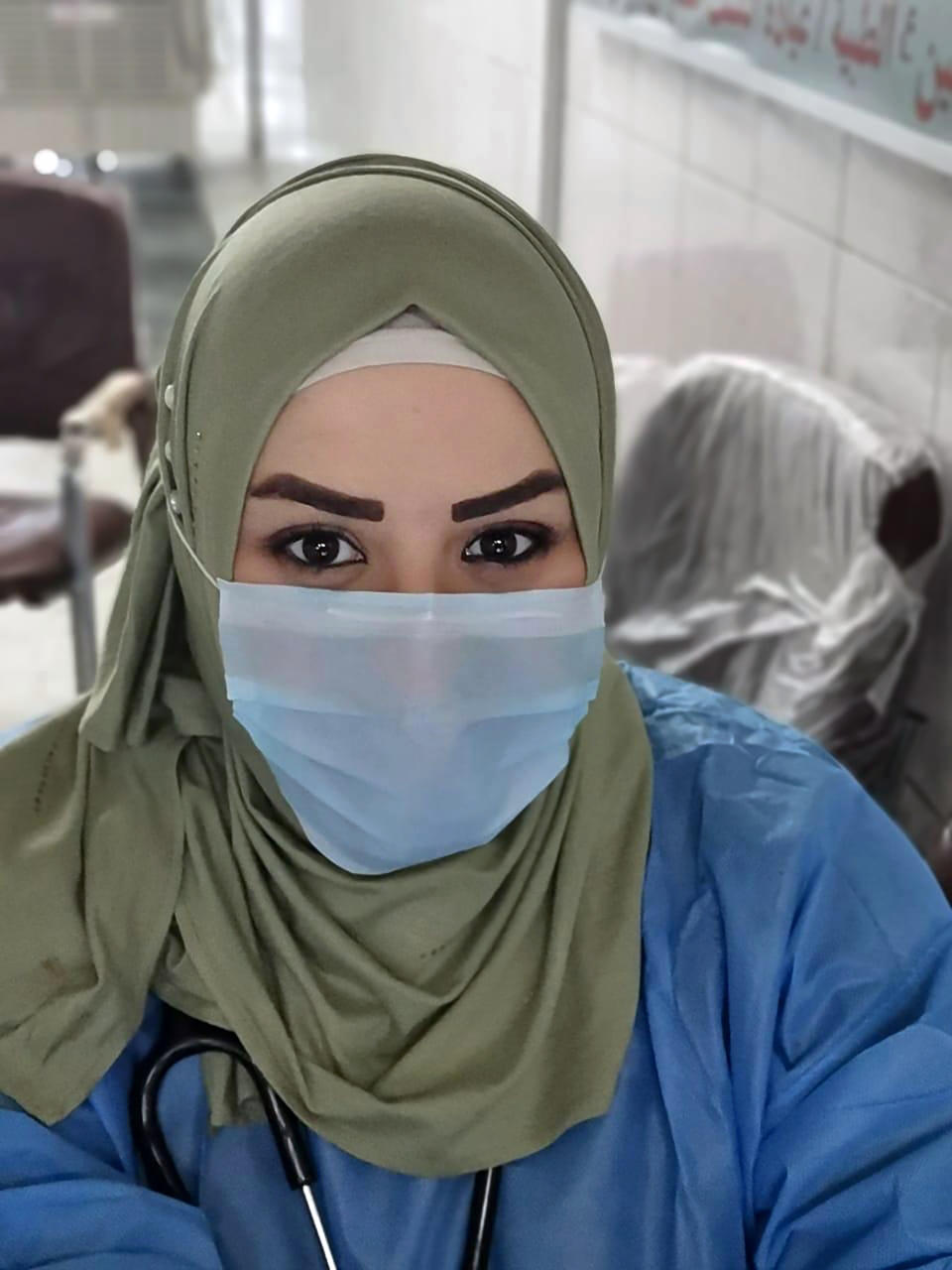 This May 13, 2020, picture provided by Dr. Marwa al-Khafaji shows the doctor back at work following 20 days in isolation after she tested positive for the coronavirus, at a hospital in Karbala, Iraq. Dr. Marwa al-Khafaji’s homecoming from a hospital isolation ward was tainted by spite. Someone had barricaded her family home’s gate with a concrete block. The message from the neighbors was clear: She had survived coronavirus, but the stigma of having had the disease would be a more pernicious fight. (AP Photo)